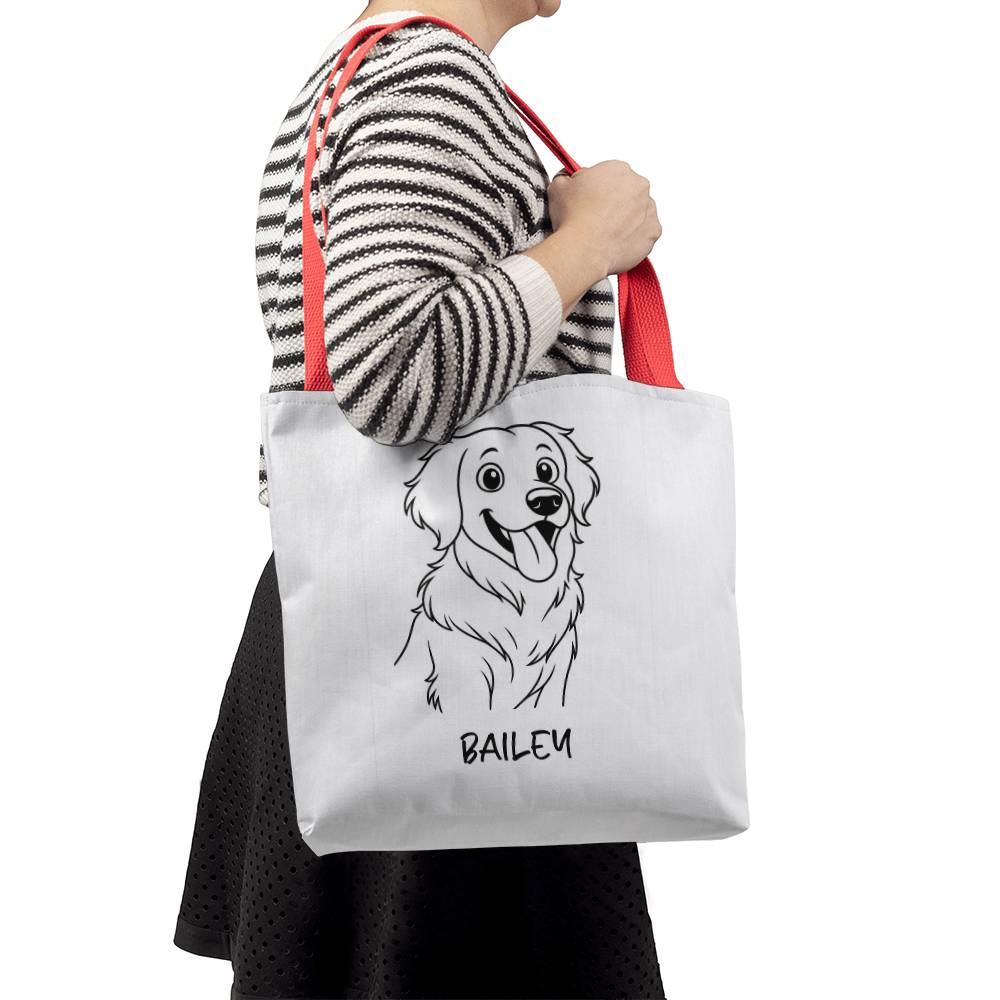 Person holding a tote bag with a dog illustration and name 'Bailey' on a white background