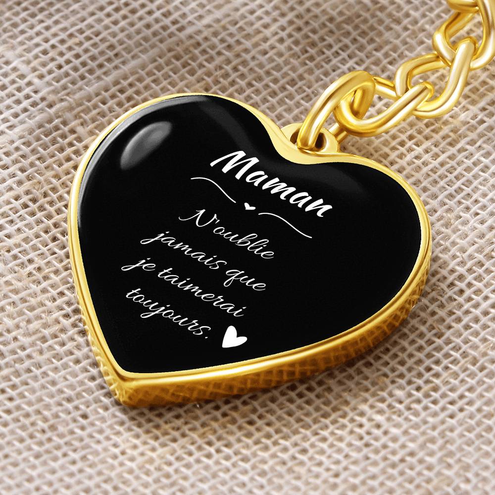 a black and gold heart shaped key chain