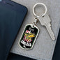 a cell phone sitting next to a key chain