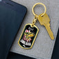 a cell phone sitting next to a key chain