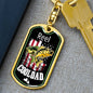 a keychain with a fish on it next to a cell phone
