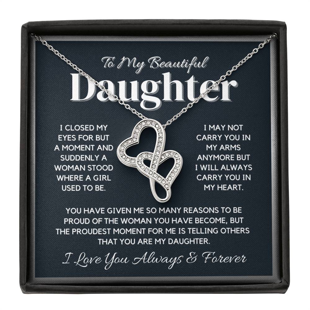 A silver necklace with a heart-shaped pendant featuring the words 'To My Beautiful Daughter' and a sparkling cubic zirconia crystal. The pendant is attached to an adjustable chain.