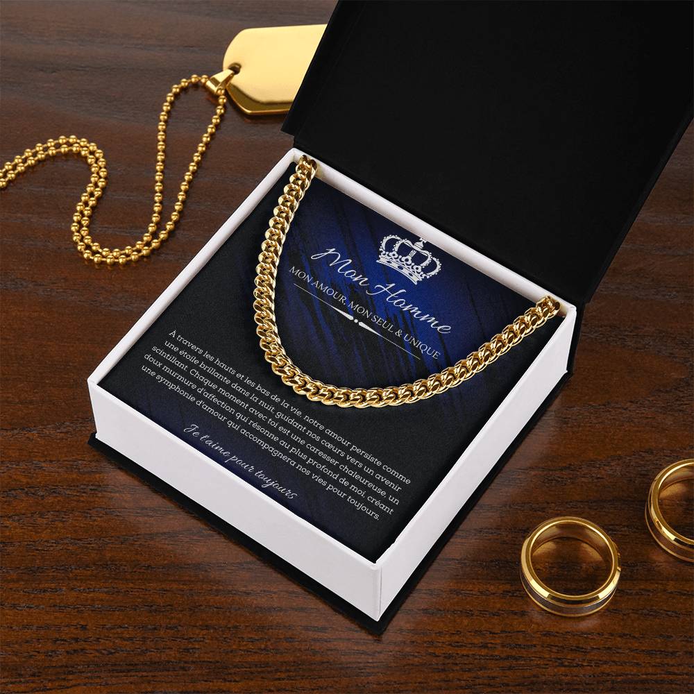 A polished metallic chain necklace on a dark blue and black background with French text detailing a romantic message for my man.
