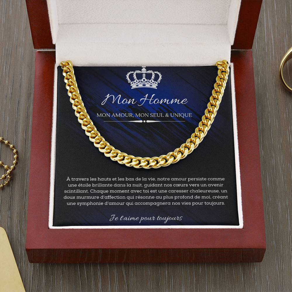 A polished metallic chain necklace on a dark blue and black background with French text detailing a romantic message for my man.