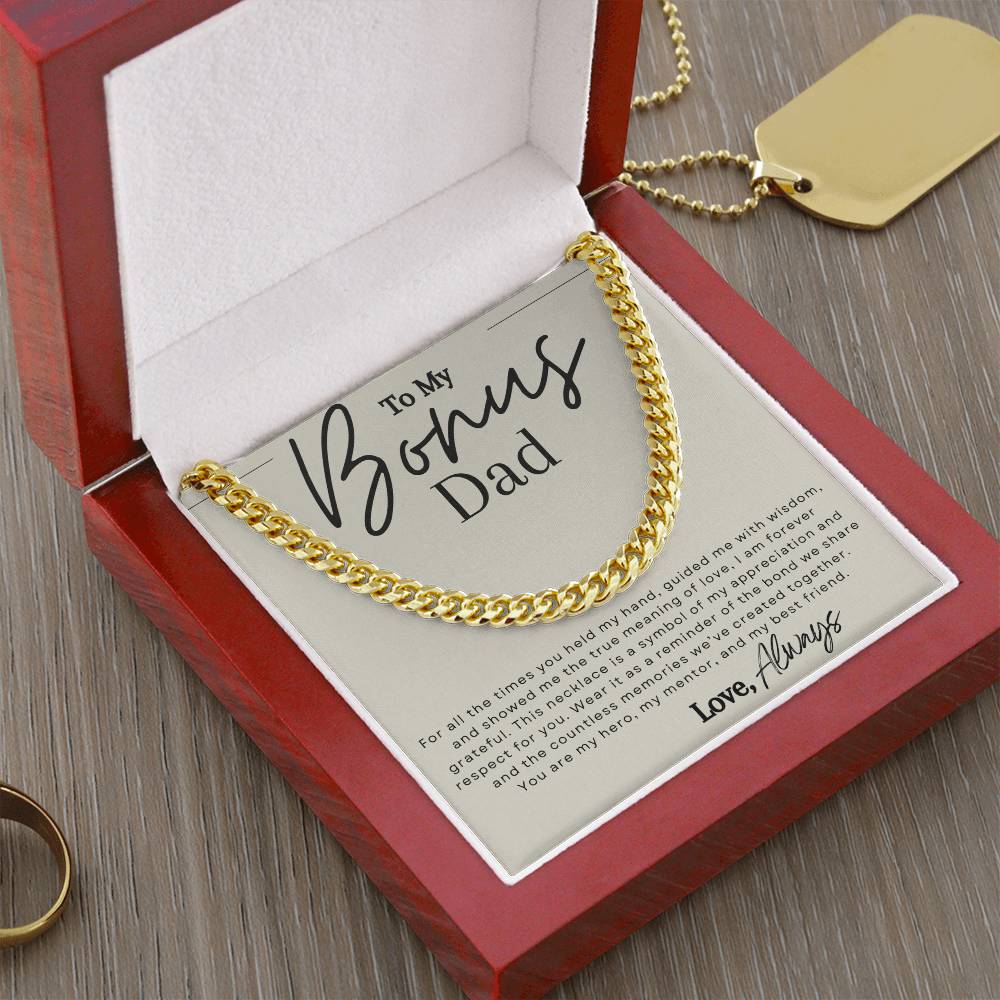 Gold chain necklace with message that reads "to my bonus dad" in elegant script font.