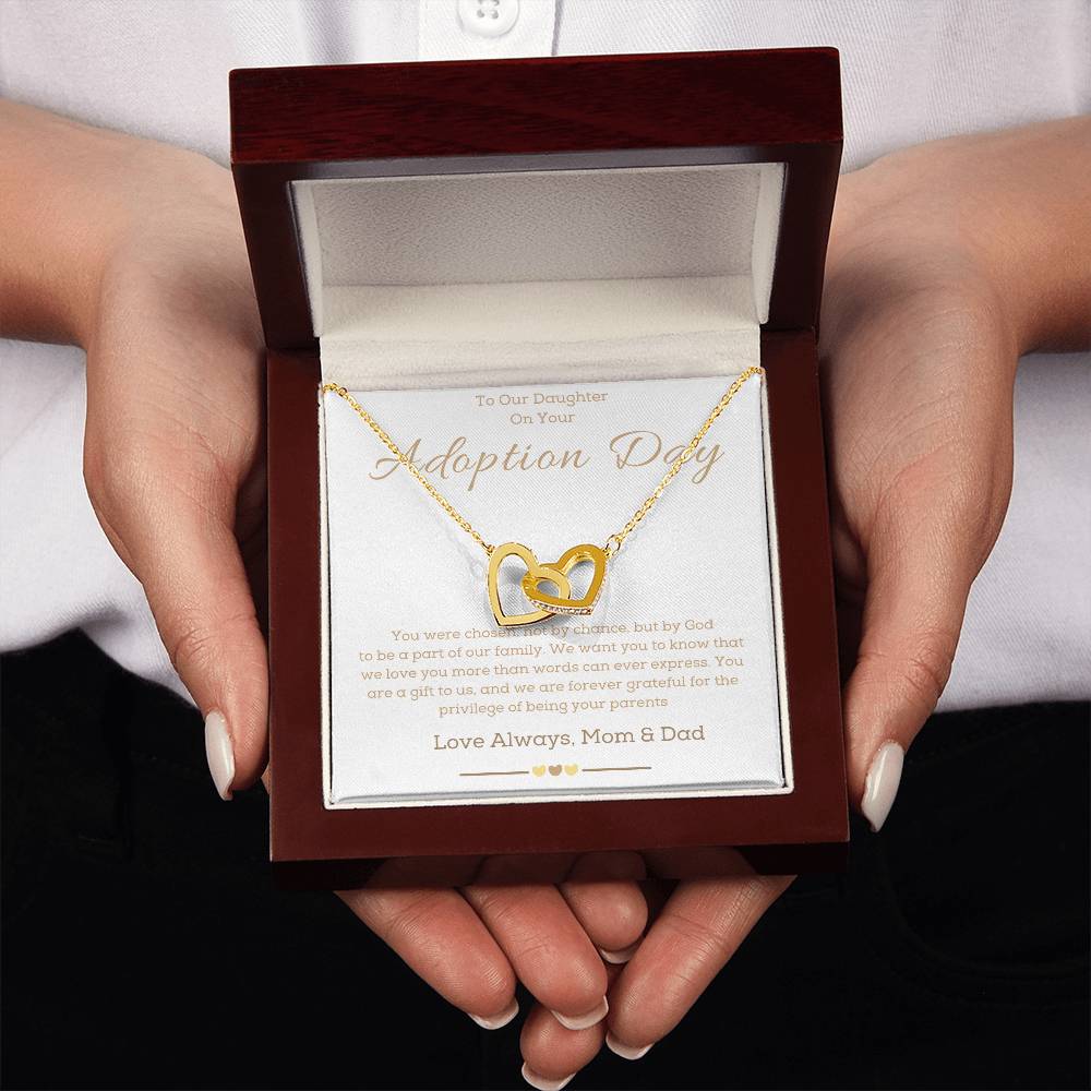 a necklace with two hearts in the middle of it and a message for adoption dedicate to a girl