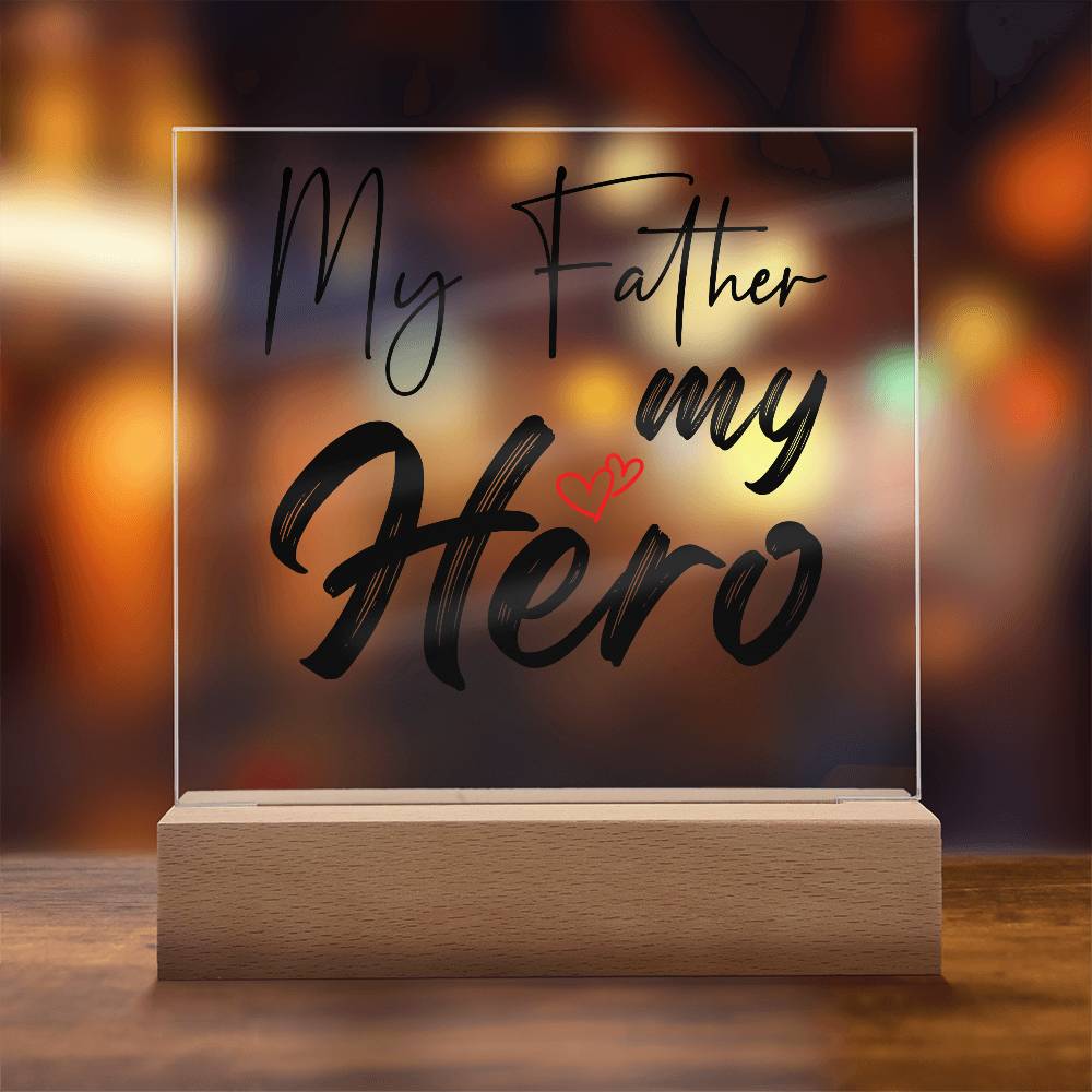 A square glass plaque on a wooden base with text reading "My Father my Hero" and a small red heart design, making it the perfect bestdad gift for Father's Day.