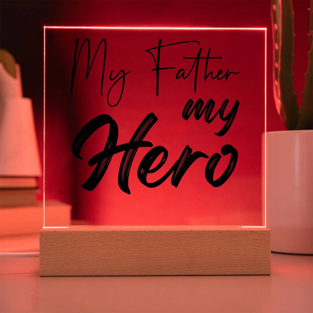 A square glass plaque on a wooden base with text reading "My Father my Hero" and a small red heart design, making it the perfect bestdad gift for Father's Day.