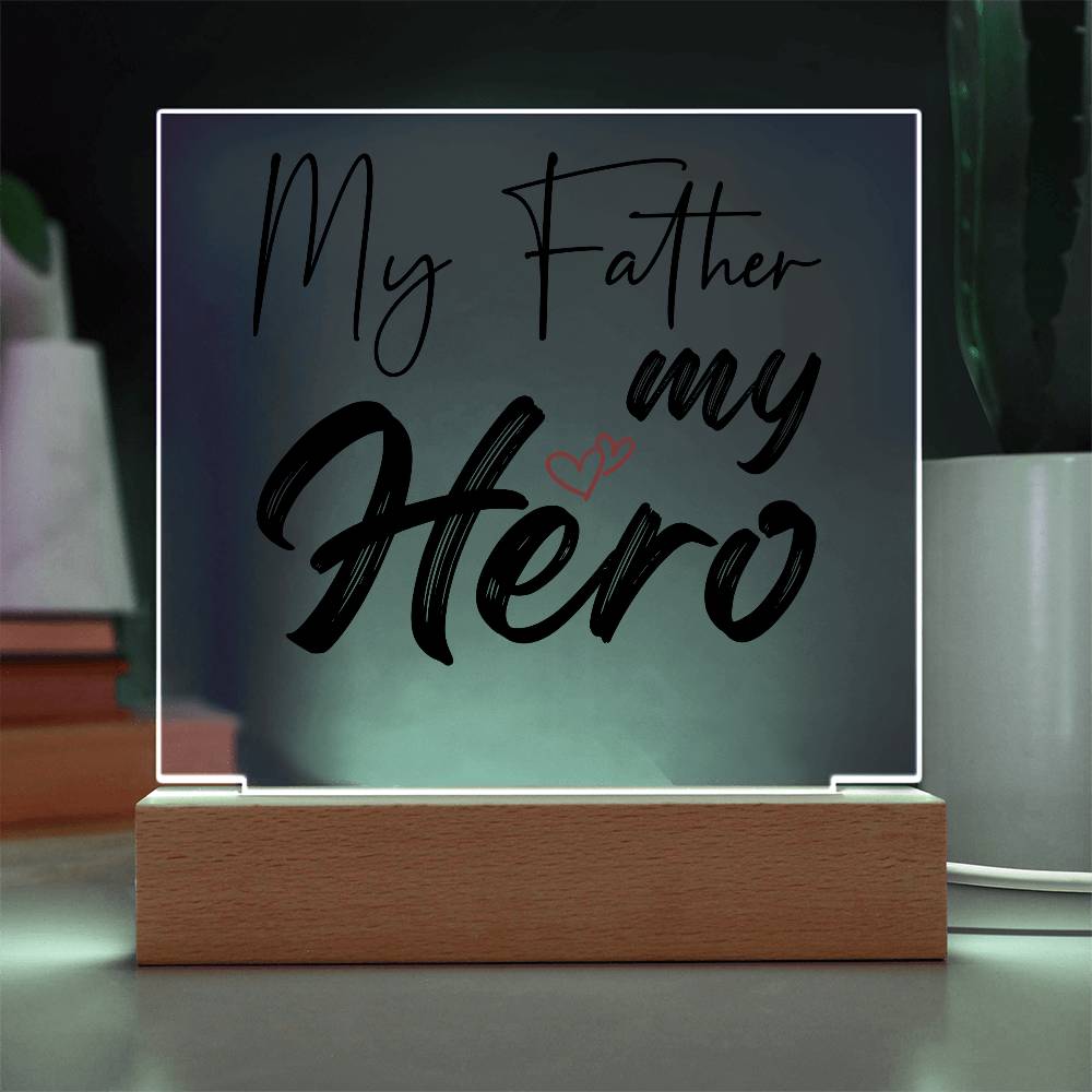 A square glass plaque on a wooden base with text reading "My Father my Hero" and a small red heart design, making it the perfect bestdad gift for Father's Day.