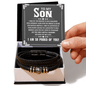 Black leather bracelet with gold and silver accents in a box with a message card for a son.