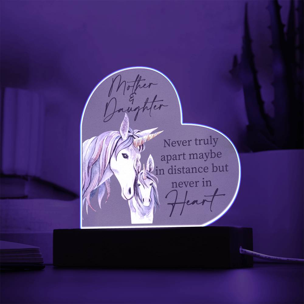 a heart shaped light with a picture of a unicorn on it