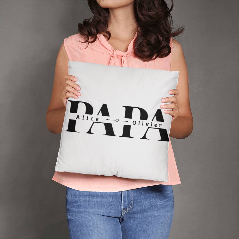 a woman holding a pillow with the words papa on it