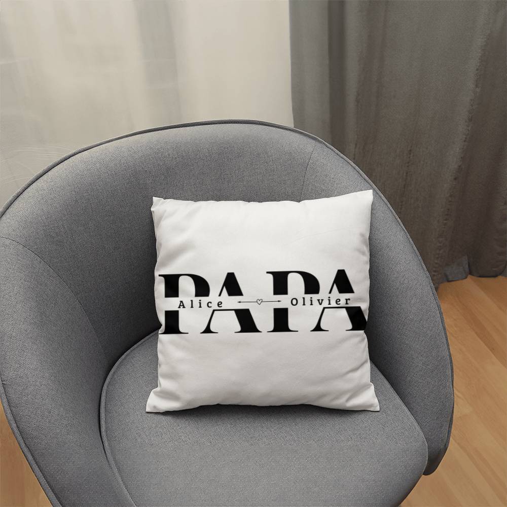 a white pillow sitting on top of a gray chair
