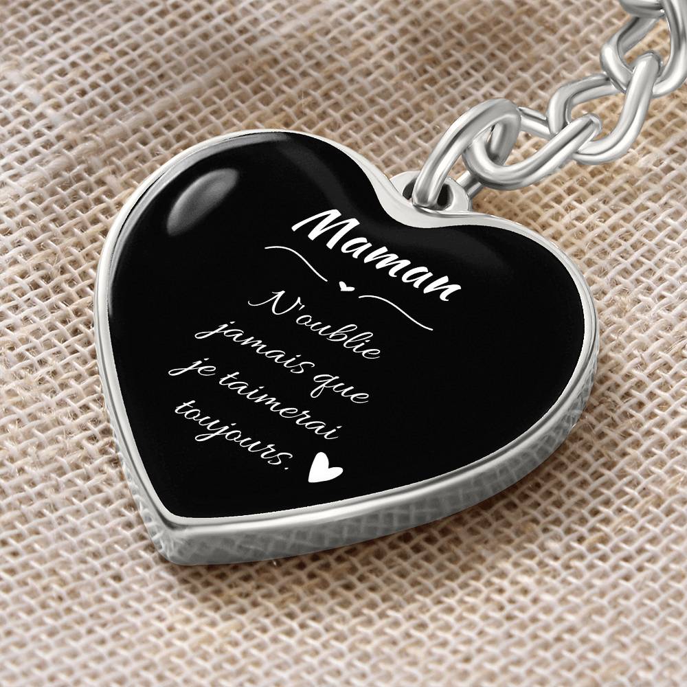 a heart shaped keychain with a message on it