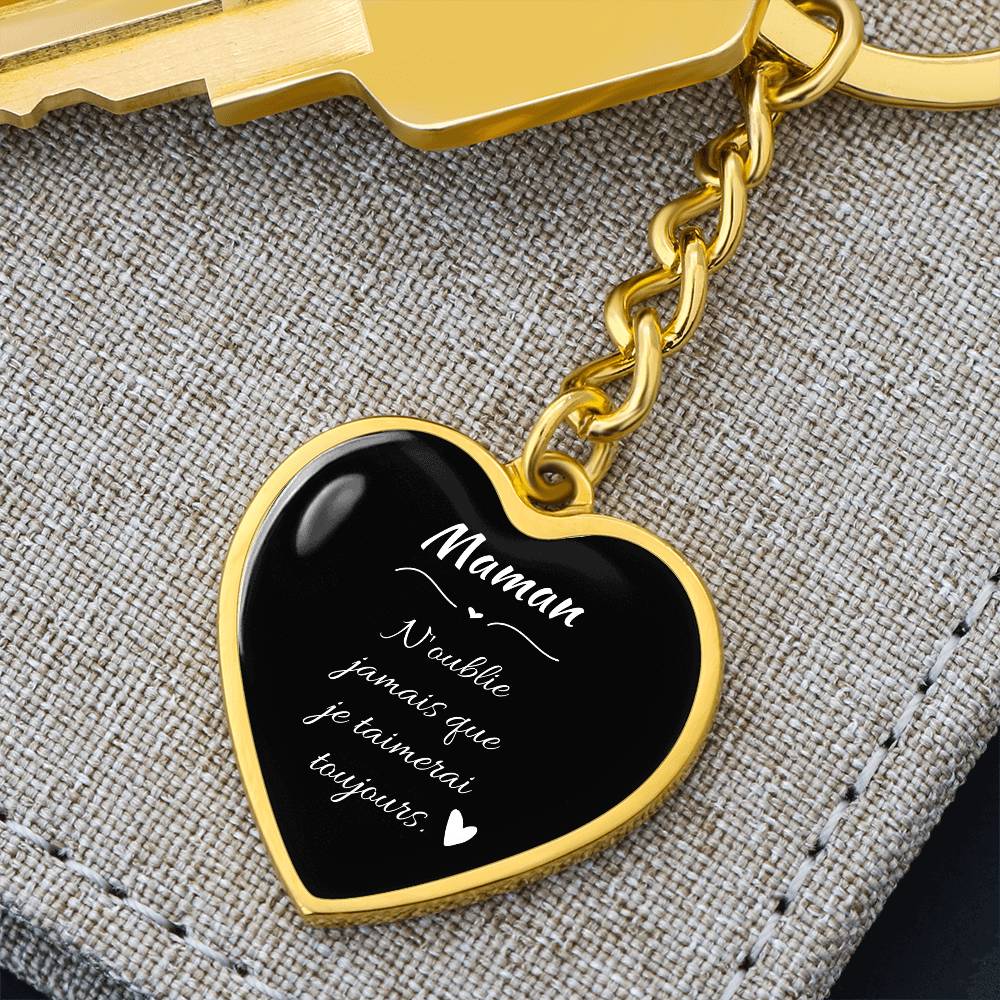 a heart shaped keychain with a key chain attached to it