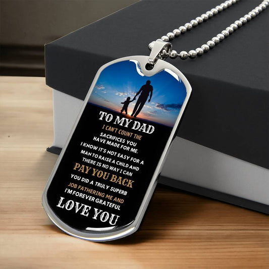 a dog tag with a picture of a man and a daughteron it