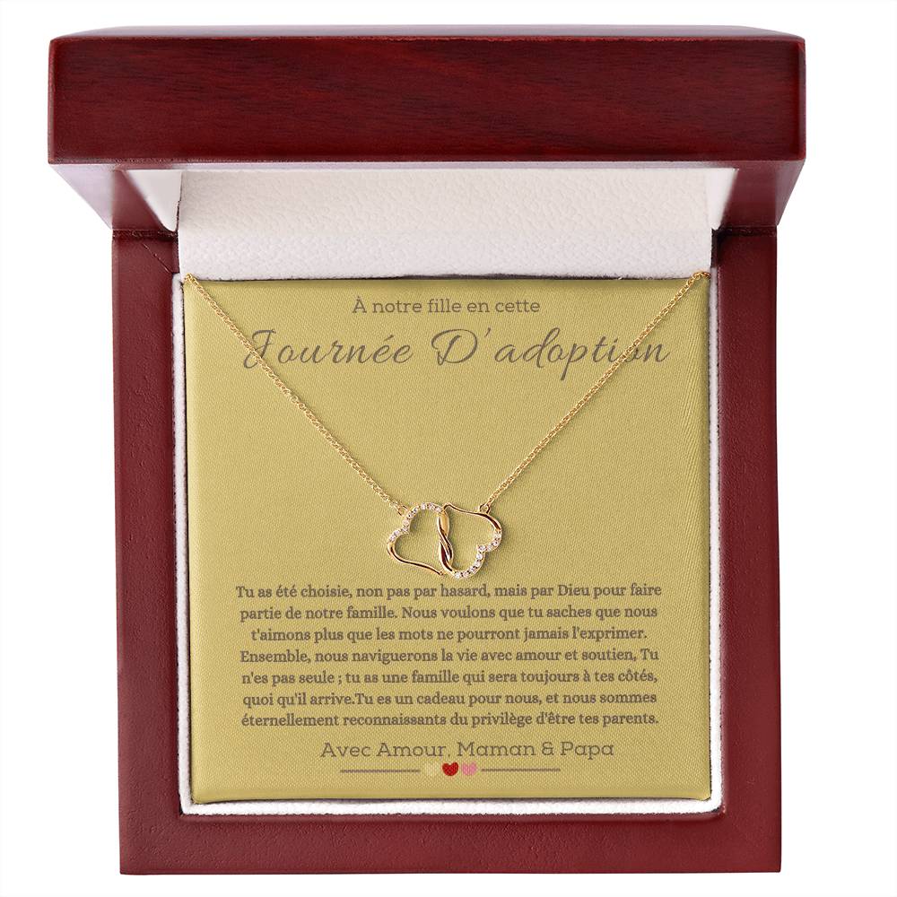 A boxwith goldhearts tide together in 10k gold for adotion gift for daughter