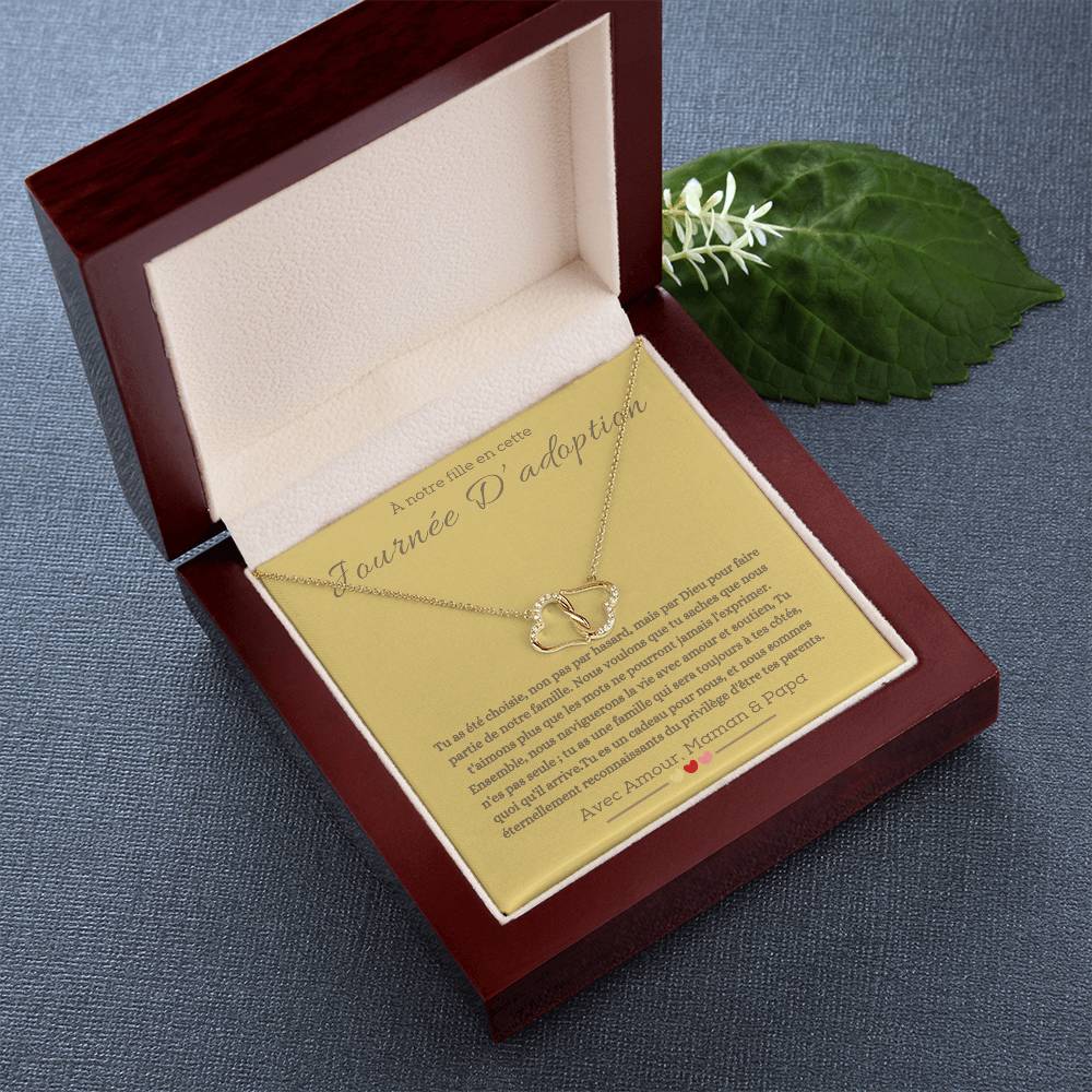 A boxwith goldhearts tide together in 10k gold for adotion gift for daughter