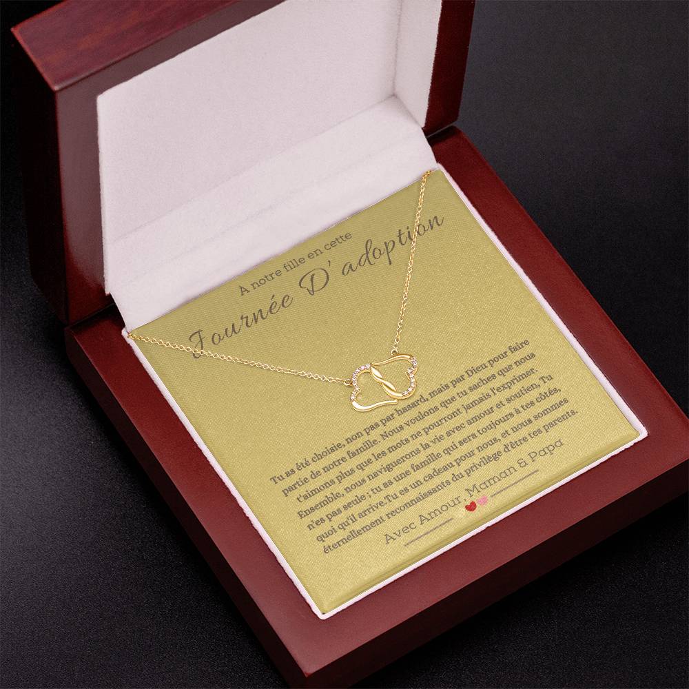 A boxwith goldhearts tide together in 10k gold for adotion gift for daughter