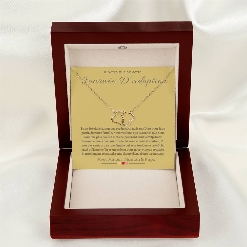 A boxwith goldhearts tide together in 10k gold for adotion gift for daughter