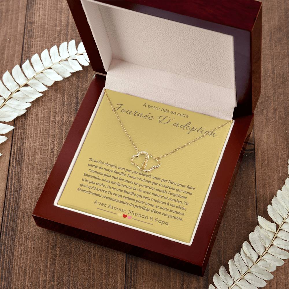 A boxwith goldhearts tide together in 10k gold for adotion gift for daughter