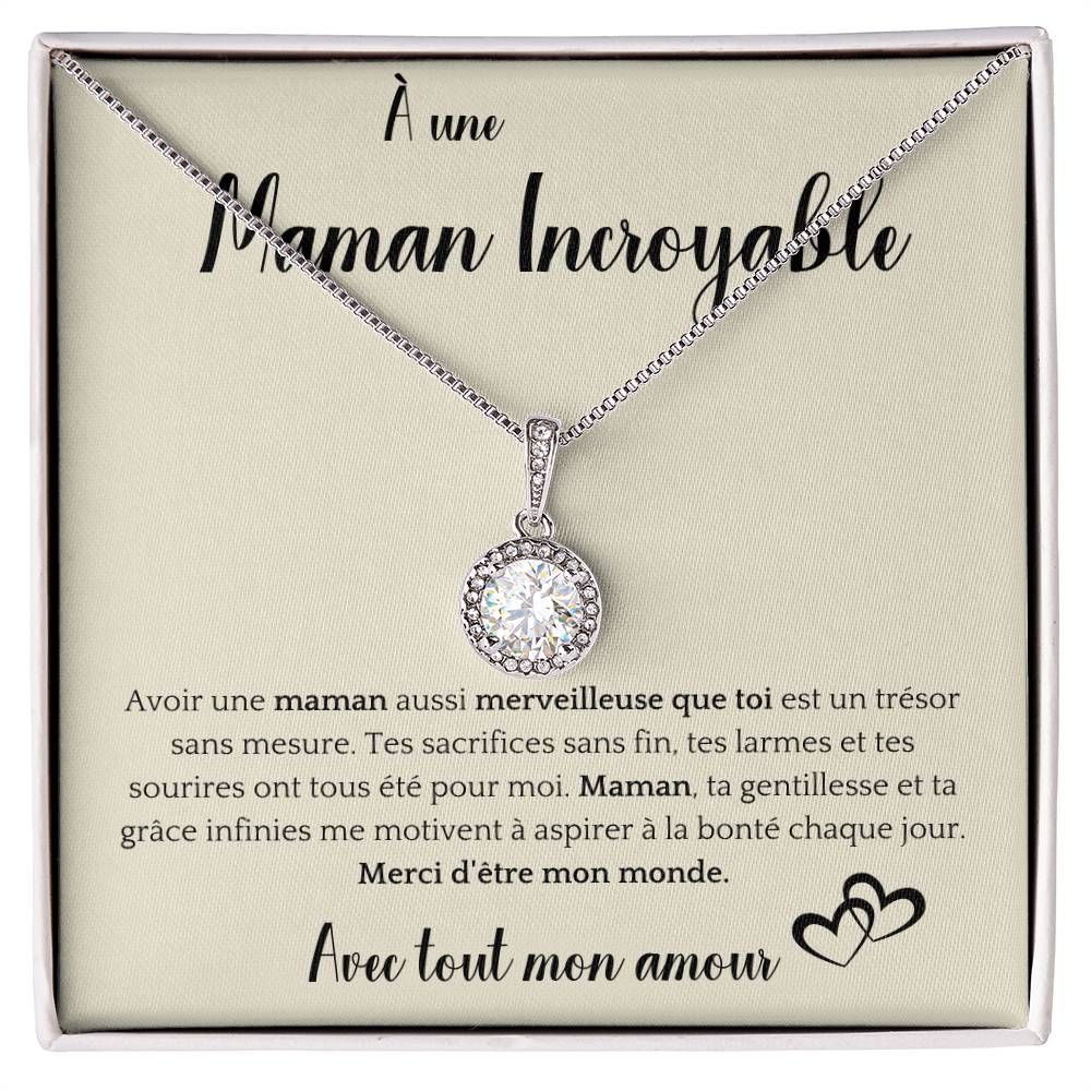 The image shows a card with a silver necklace featuring a round pendant with a central gemstone. The card reads "À une Maman Incroyable" at the top, with a heartfelt French message about the mother's sacrifices and kindness. It ends with "Avec tout mon amour" and a heart illustration.