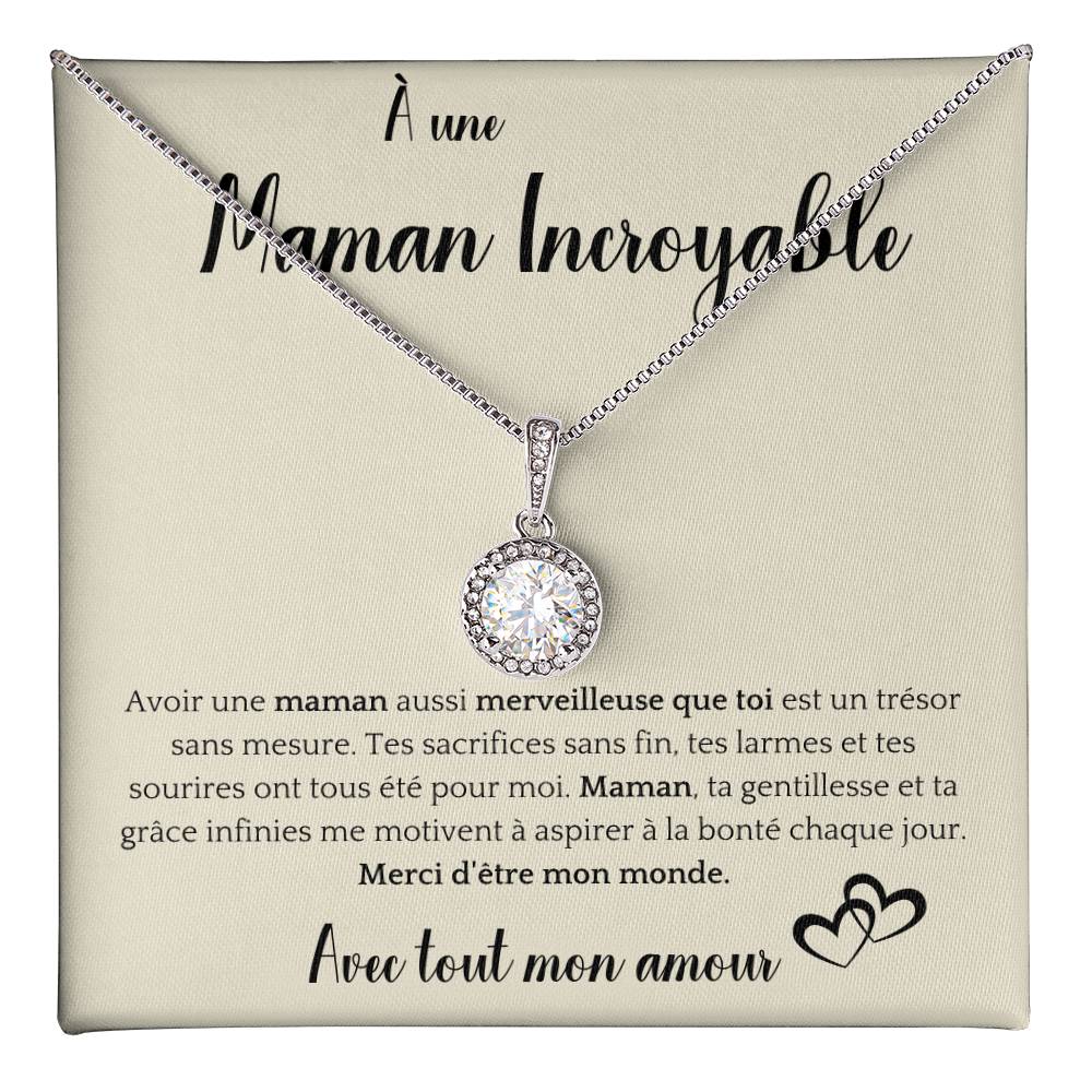 The image shows a card with a silver necklace featuring a round pendant with a central gemstone. The card reads "À une Maman Incroyable" at the top, with a heartfelt French message about the mother's sacrifices and kindness. It ends with "Avec tout mon amour" and a heart illustration.