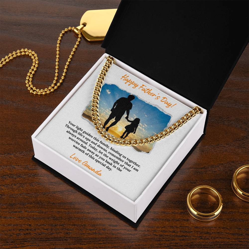 a couple of gold rings sitting on top of a wooden table