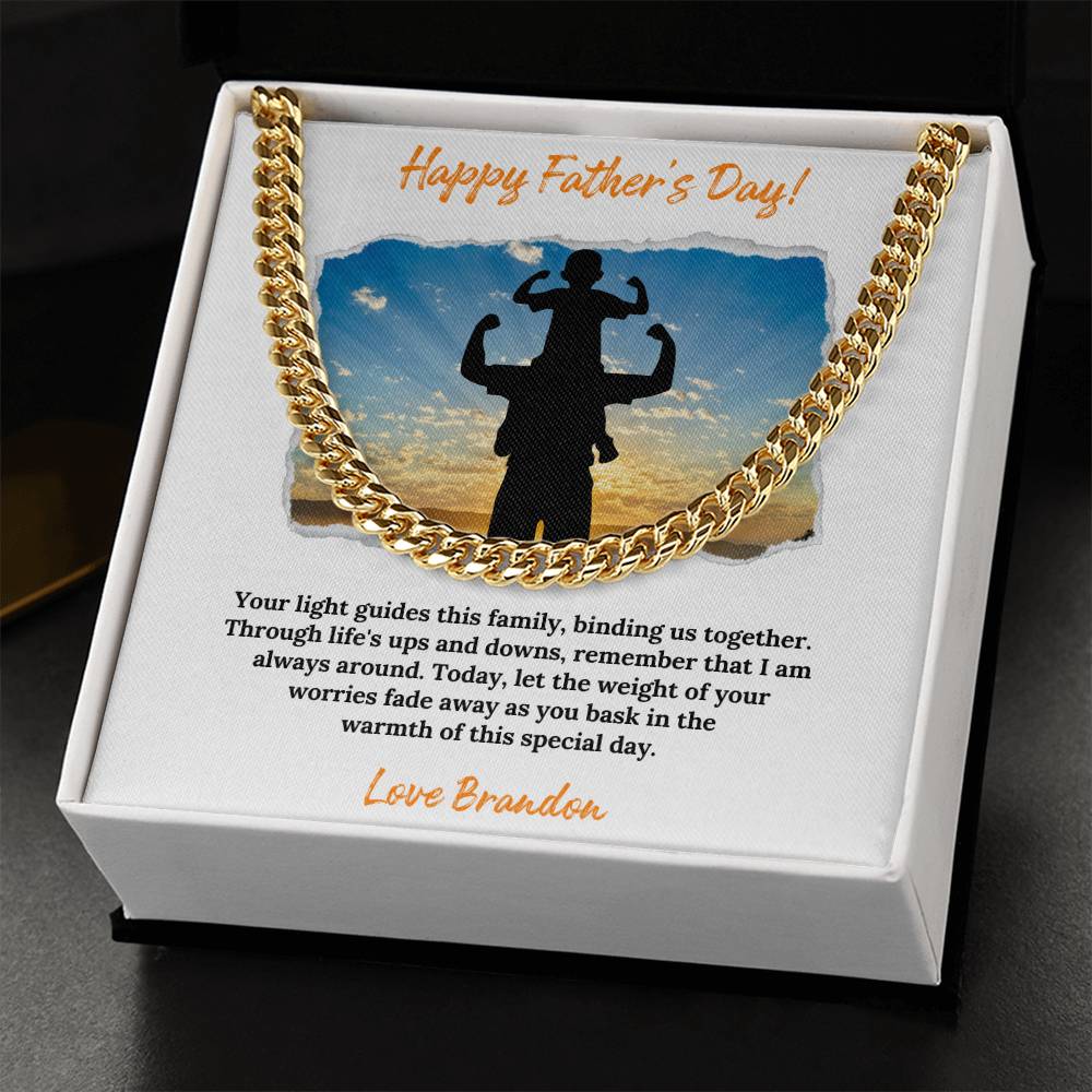 a gold necklace with a picture of a man on it