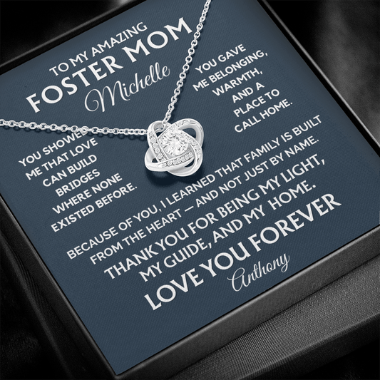 Silver necklace with a heart pendant on a personalized card for an amazing foster mom.