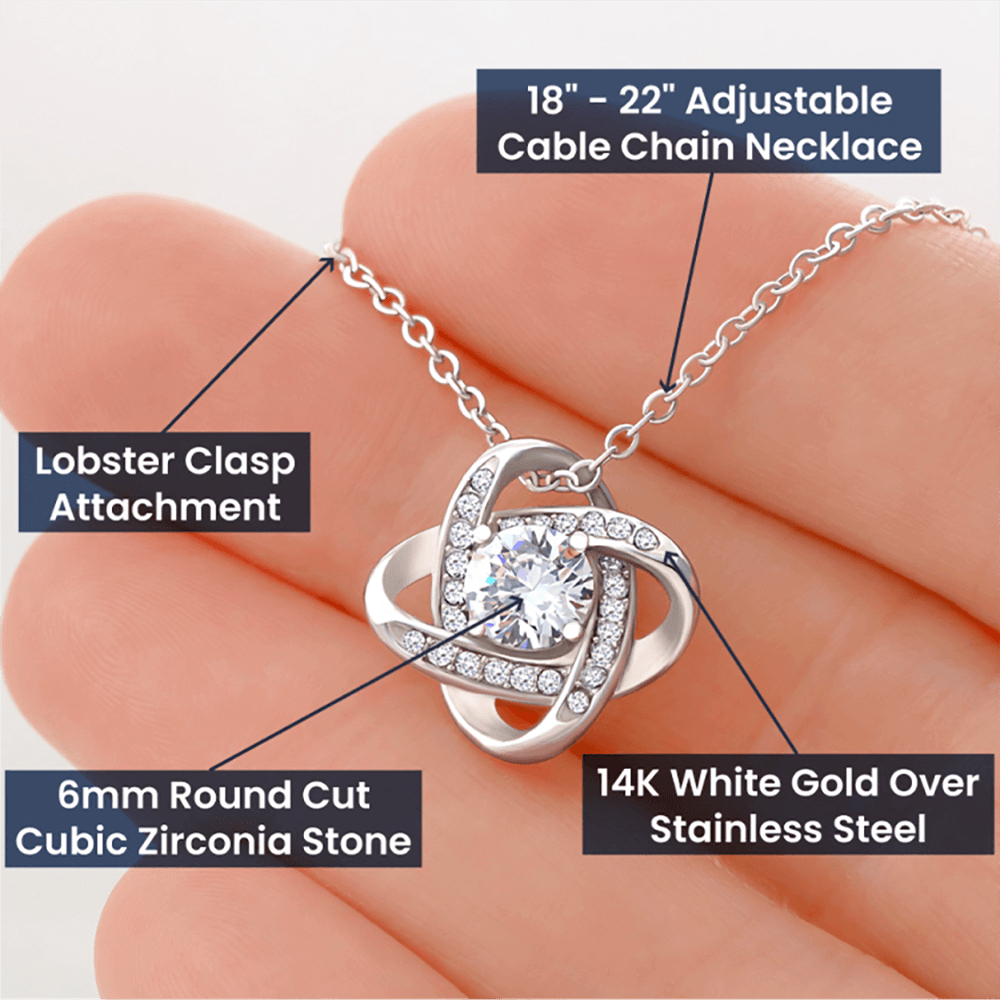 Necklace with an intertwined, sparkling pendant in a gift box for daughter.