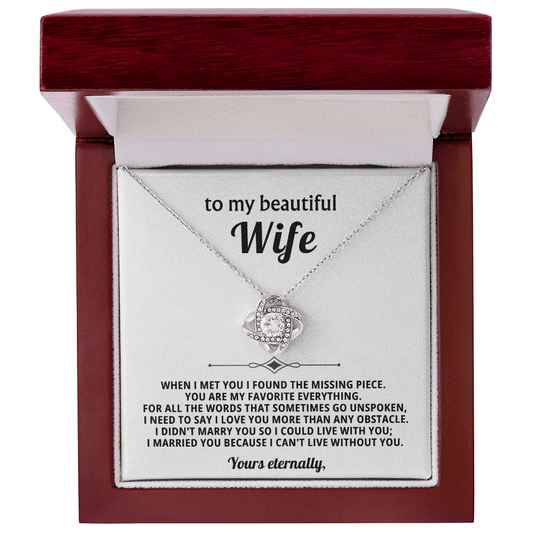 Necklace in a wooden box with a sentimental message for a wife.