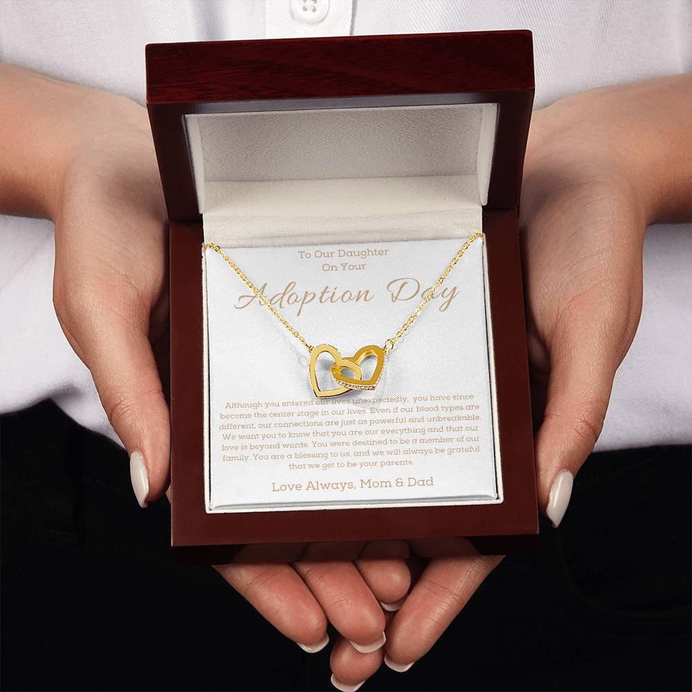 a necklace in a box for a girl on her adotion day