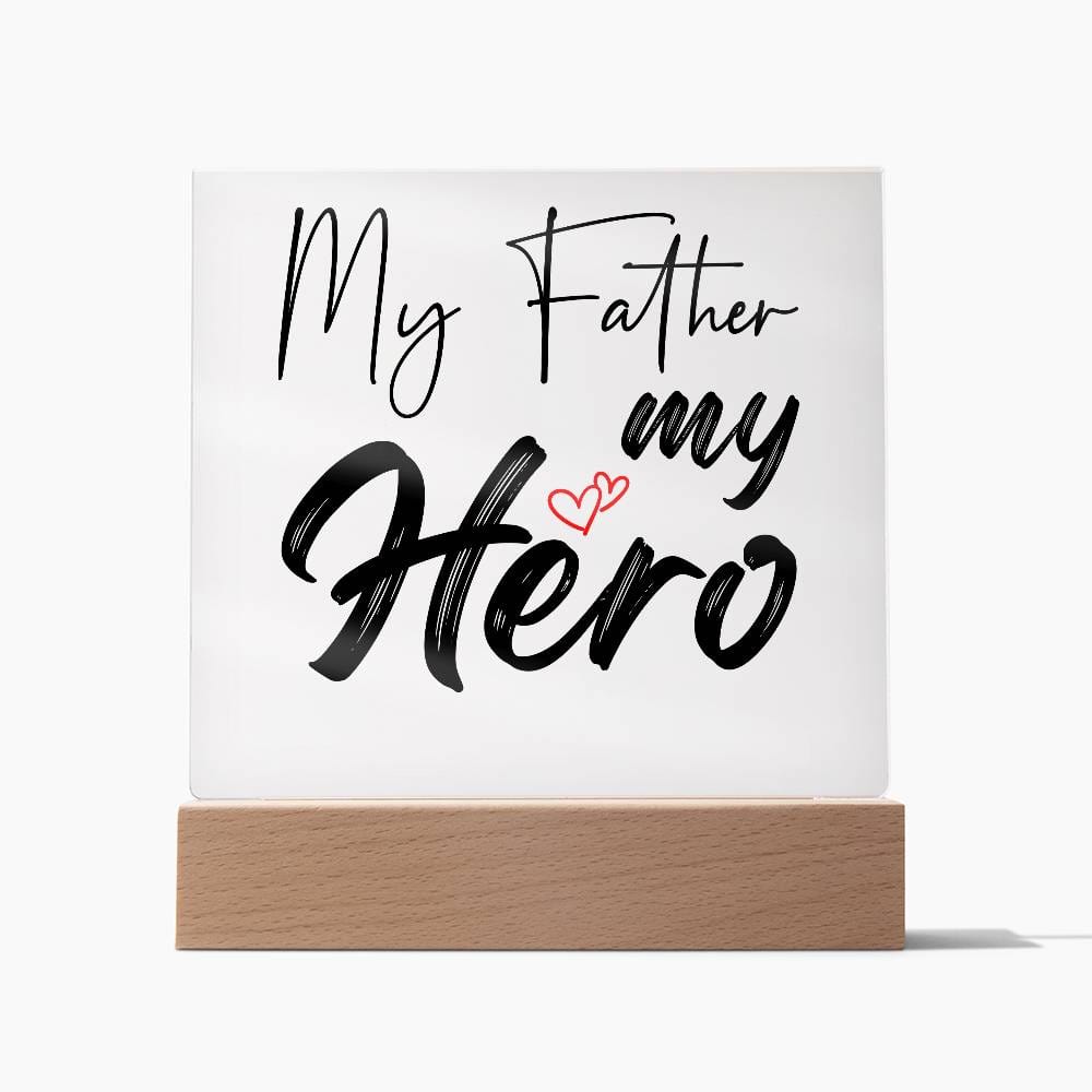 A square glass plaque on a wooden base with text reading "My Father my Hero" and a small red heart design, making it the perfect bestdad gift for Father's Day.