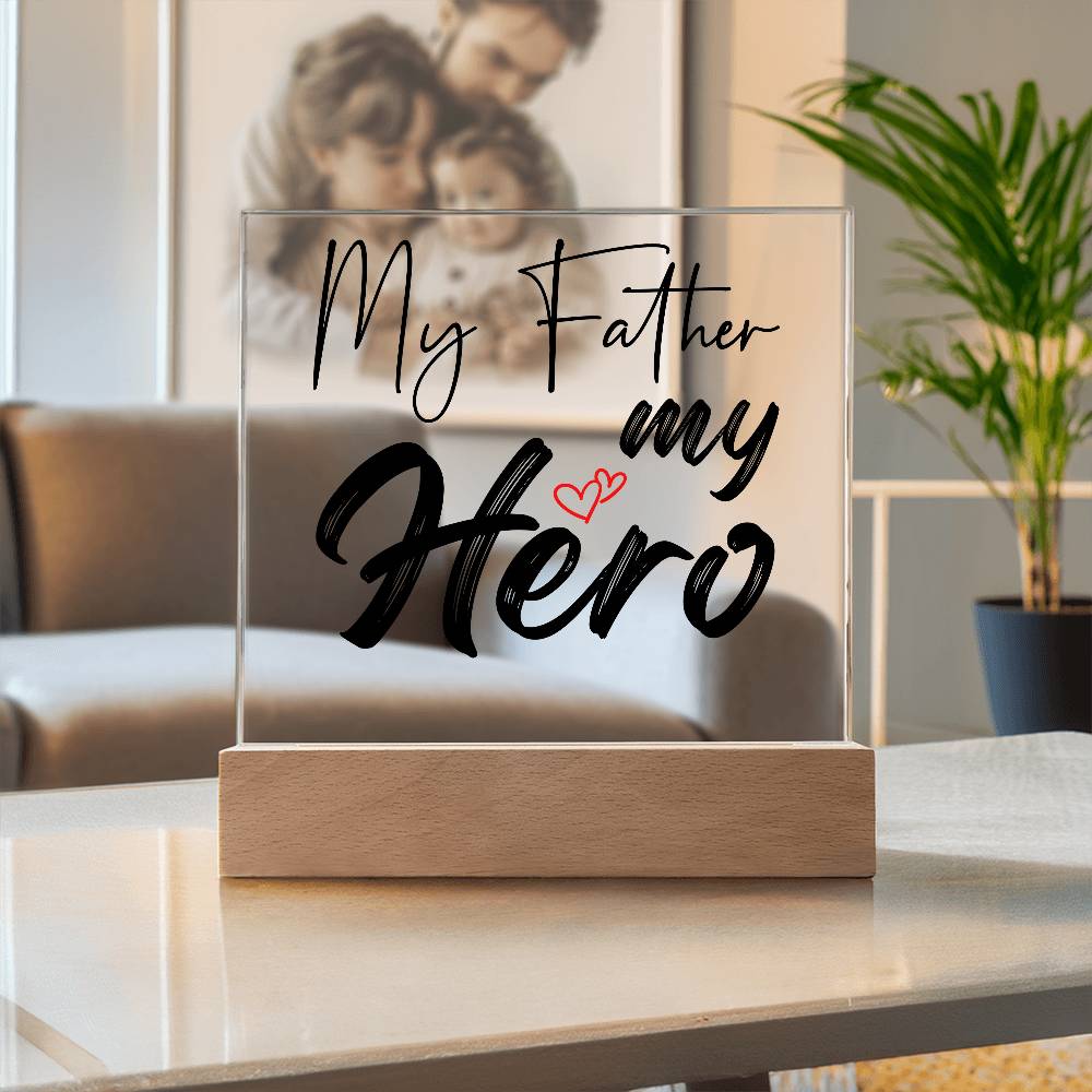 A square glass plaque on a wooden base with text reading "My Father my Hero" and a small red heart design, making it the perfect bestdad gift for Father's Day.