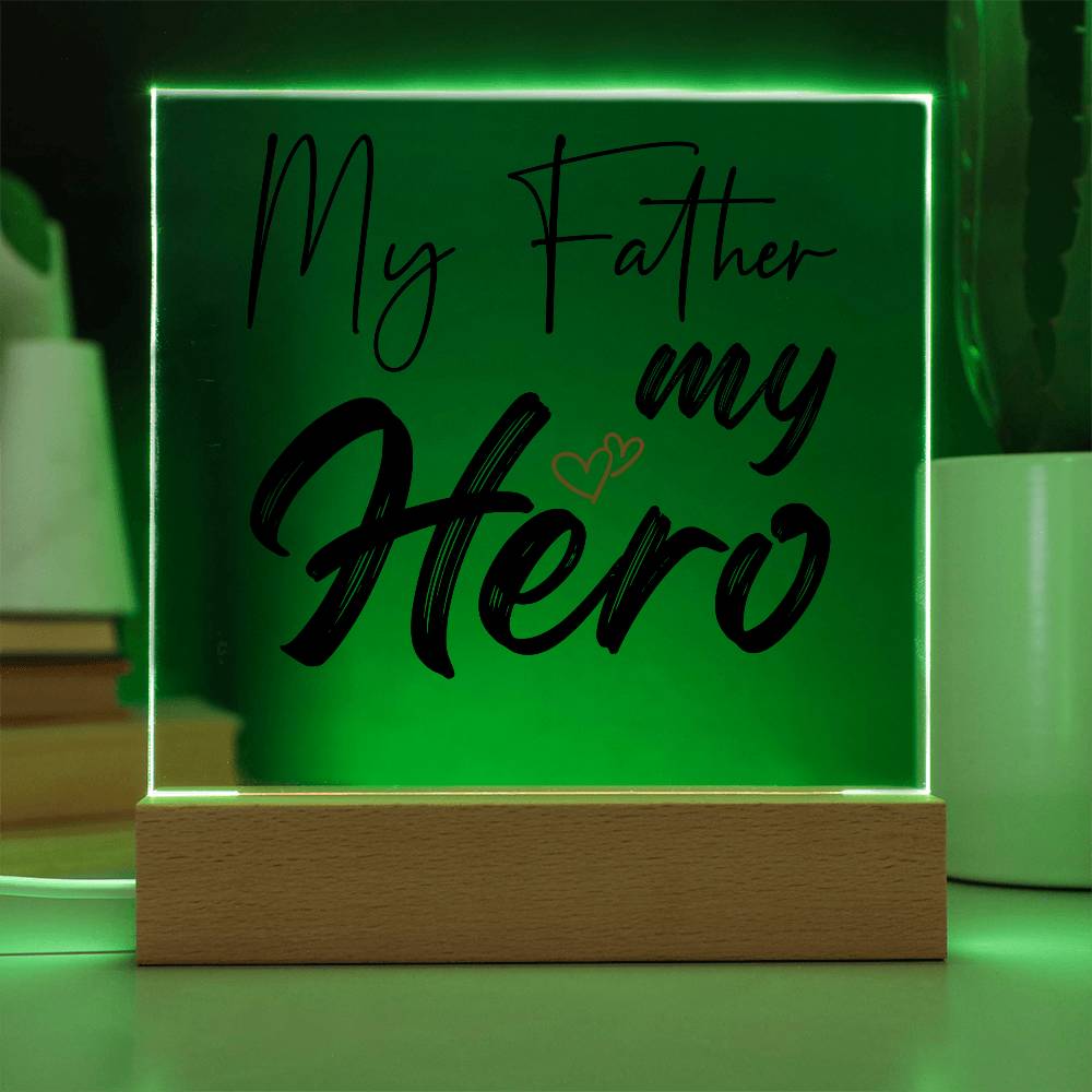 A square glass plaque on a wooden base with text reading "My Father my Hero" and a small red heart design, making it the perfect bestdad gift for Father's Day.