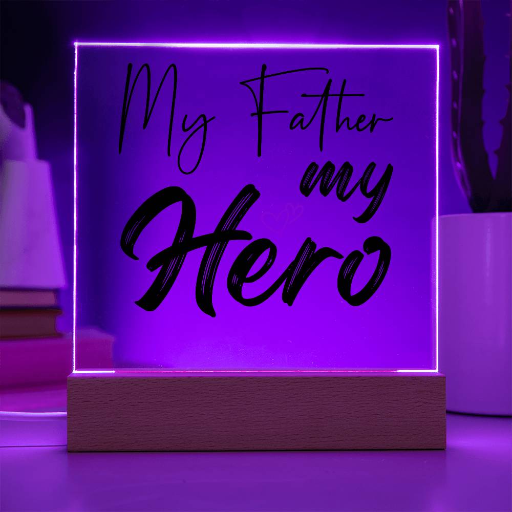 A square glass plaque on a wooden base with text reading "My Father my Hero" and a small red heart design, making it the perfect bestdad gift for Father's Day.