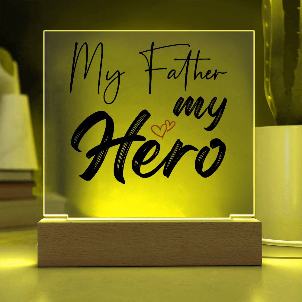 A square glass plaque on a wooden base with text reading "My Father my Hero" and a small red heart design, making it the perfect bestdad gift for Father's Day.