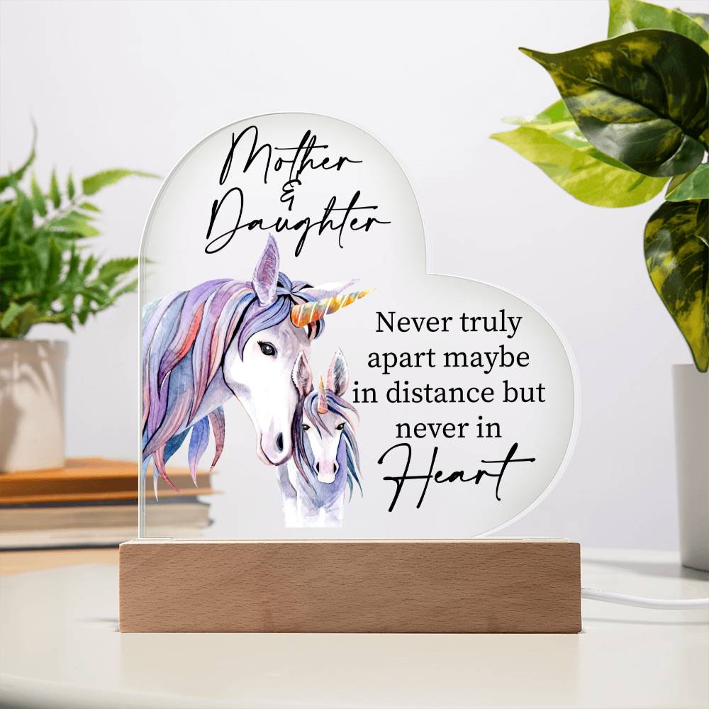 a glass plaque with a picture of a unicorn on it