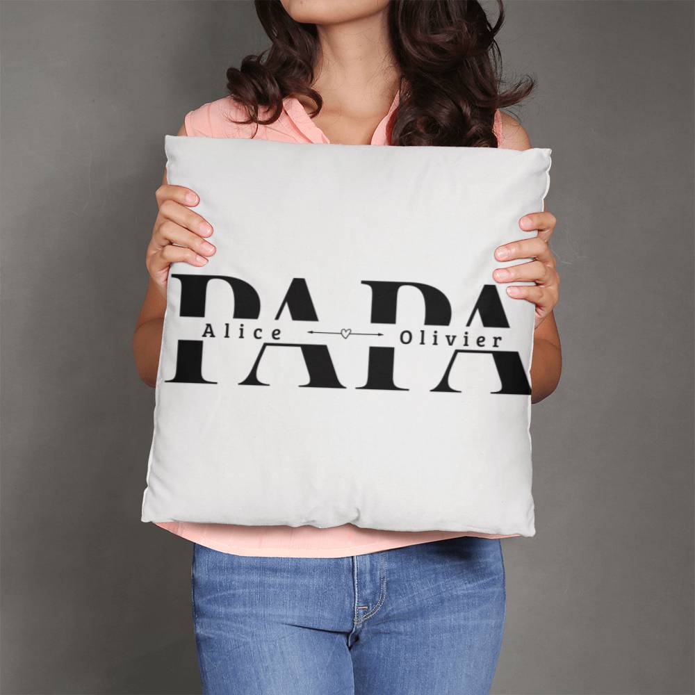 a woman holding a pillow with the word papa on it