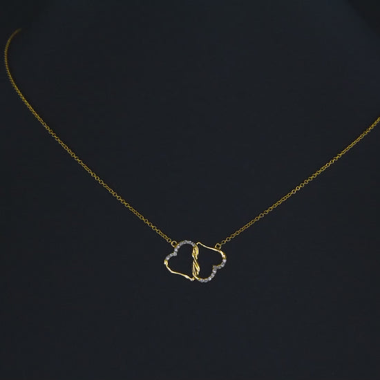 A boxwith goldhearts tide together in 10k gold for adotion gift for daughter