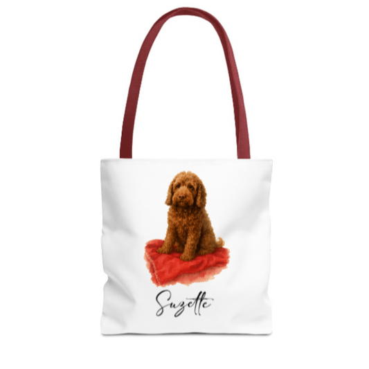 Tote bag with a brown dog on a red blanket and 'Suzette' text, white background